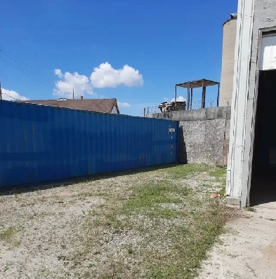 Secured Fenced In Outside Compound image