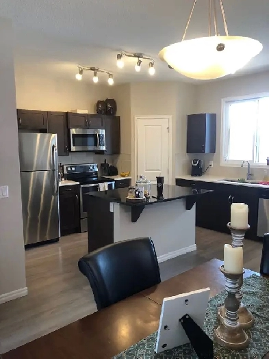 3 bedroom house for rent in Cochrane AB Internet and TV include image