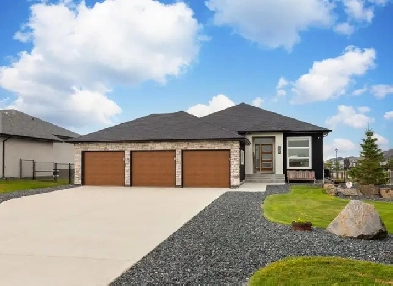 Stunning 4bdrm Bungalow wTriple Att Garage on a Prime Lake Lot image